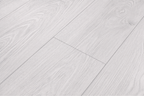 Close-up texture of ArmorCore Arctic Concrete Flooring showing natural concrete embossing and cool arctic grey detailing.