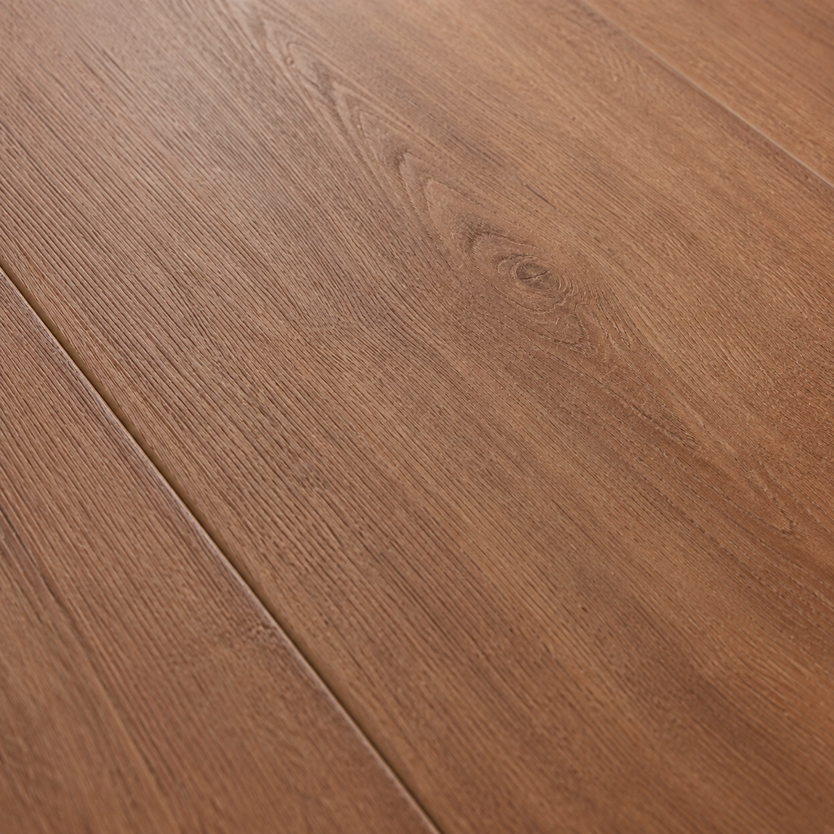 Close-up of ArmorCore Belmont Walnut Flooring highlighting authentic walnut wood grain, embossed texture, and natural wood character.
