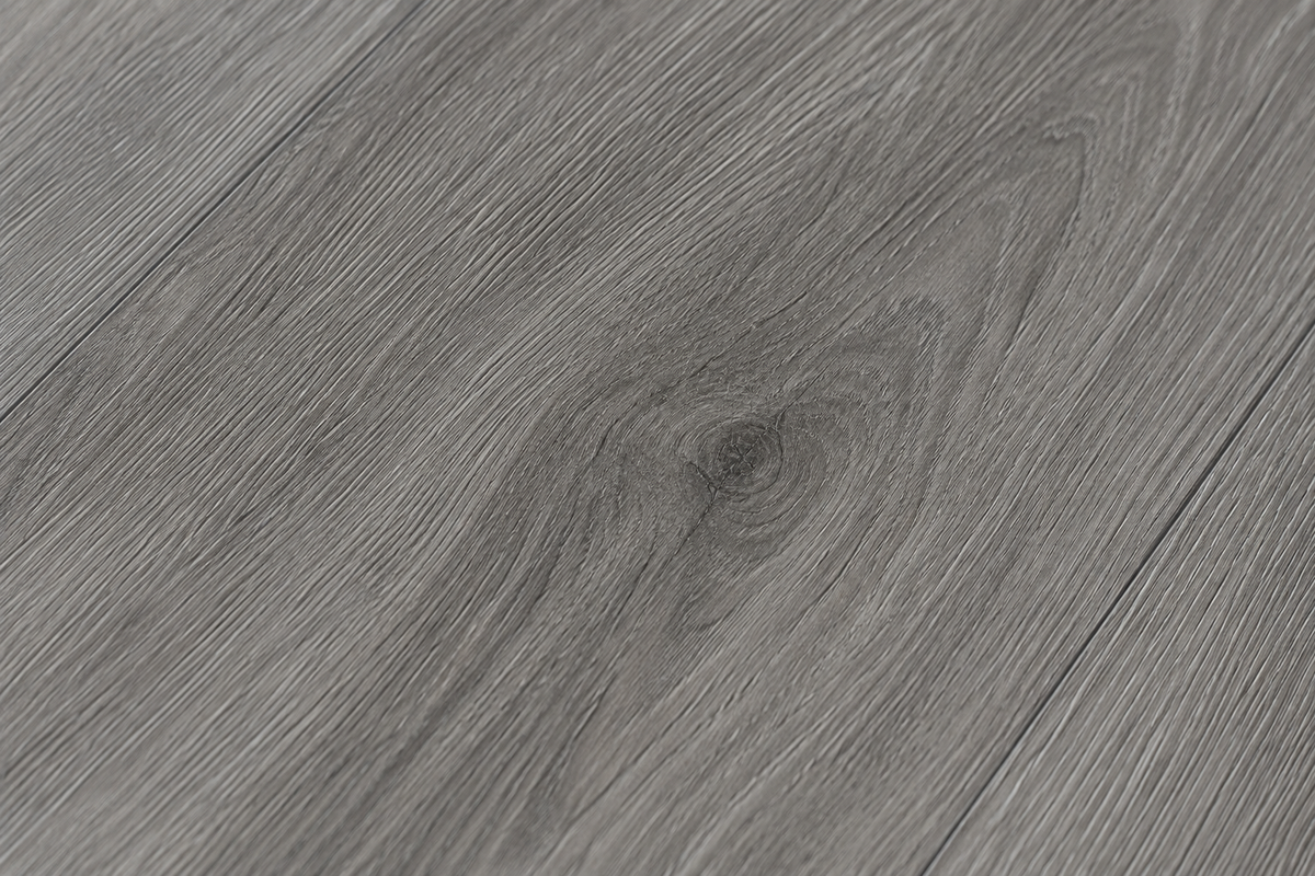 Close-up texture of ArmorCore Nordic Pine Flooring showing realistic pine grain, subtle knots and Embossed-In-Register finish.