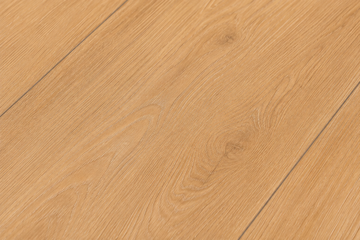 Close-up texture of ArmorCore Sierra Pine Flooring showing authentic pine grain and Embossed-In-Register finish.