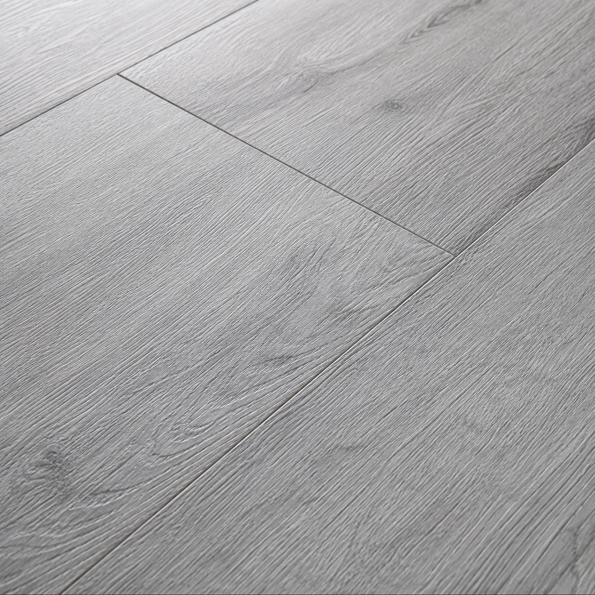 Close-up of ArmorCore Silver Ash Flooring highlighting natural silver ash grain, matte finish, and realistic embossed texture.